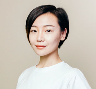 Ruijia Wang in a white shirt smiling