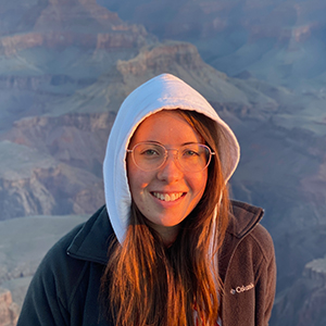 Caitlin wearing glasses in front of a canyon