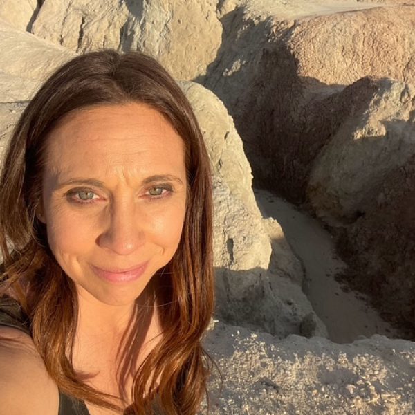 Jen Morton outside with the Mud Hills in the background